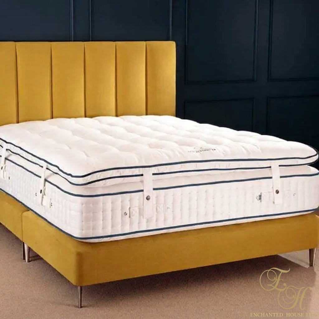 Enchanted House bed photo with a small gold corner logo