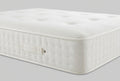 Ashford Bed Centre 1000 Four Seasons mattress showing its tufted surface and side handle
