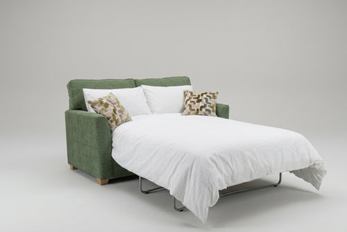 Alstons Reuben green sofa bed open displayed with patterned scatter cushions and white duvet