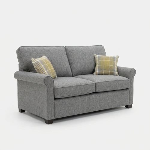 alstons_poppy_sofa-bed with plaid scatter cushion set in a studio